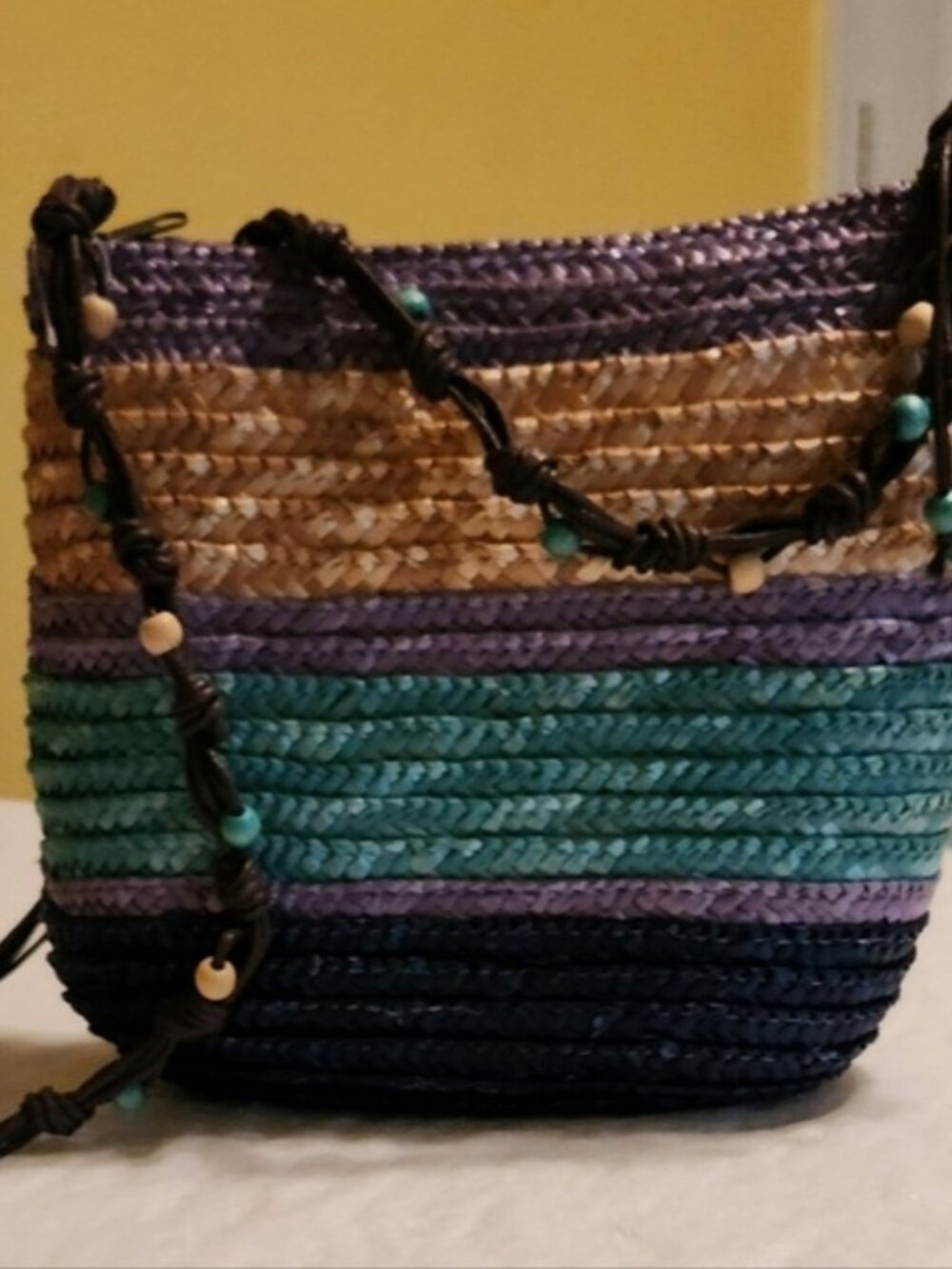 Cruise Club striped beaded woven wicker cross body bag.